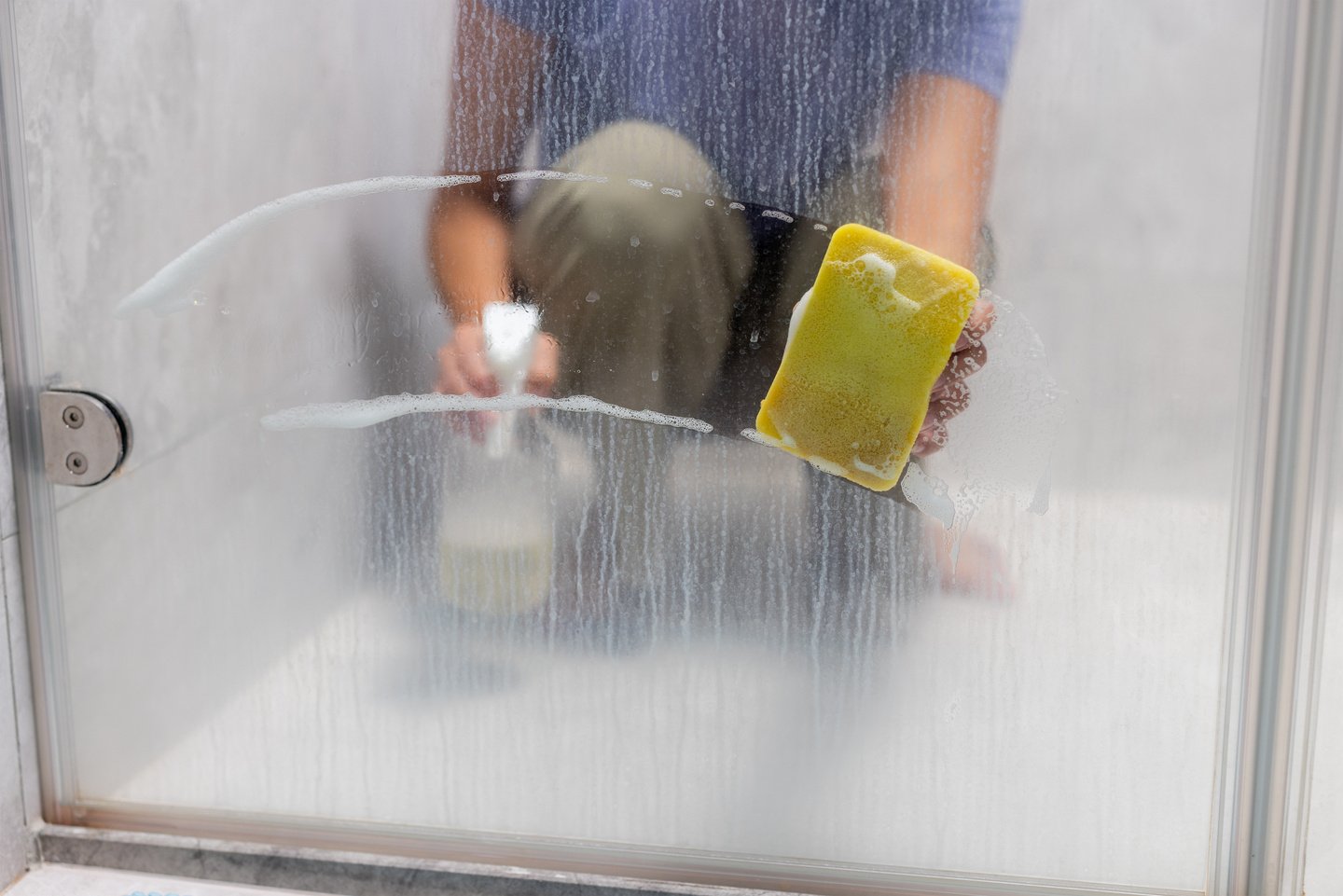 Removing hard water stains and deposits in bathroom